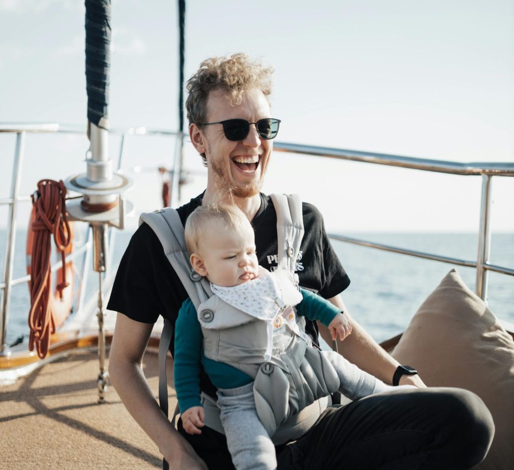 man and his baby on a yacht in ibiza